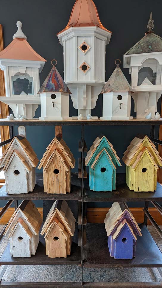 Assorted colorful birdhouses at Weston Nurseries